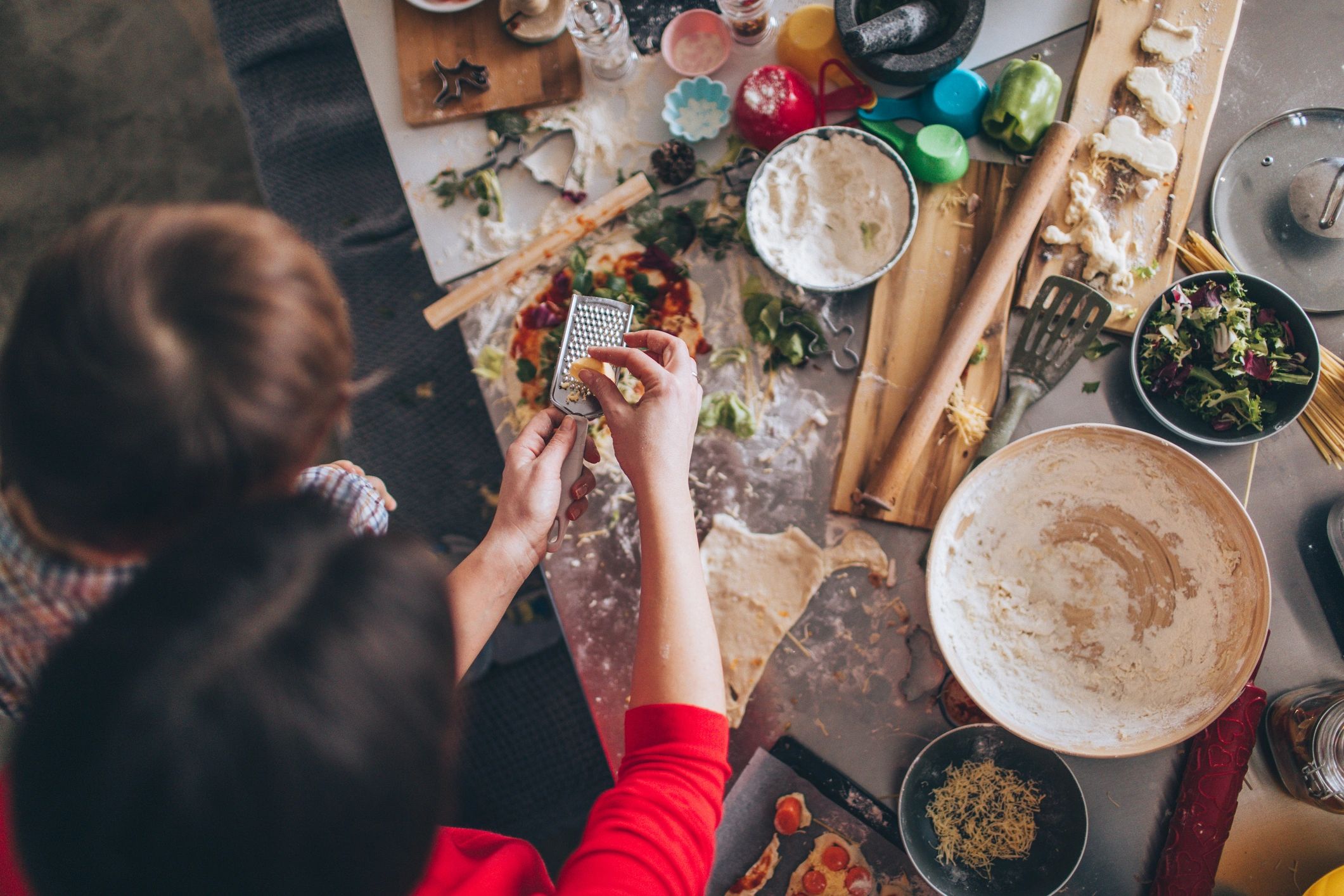 Italian family cooking at table